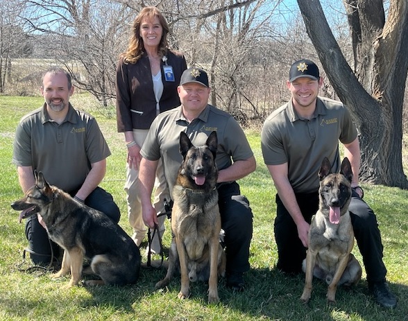 DOC K9 Teams pictured with Secretary of Corrections Kellie Wasko