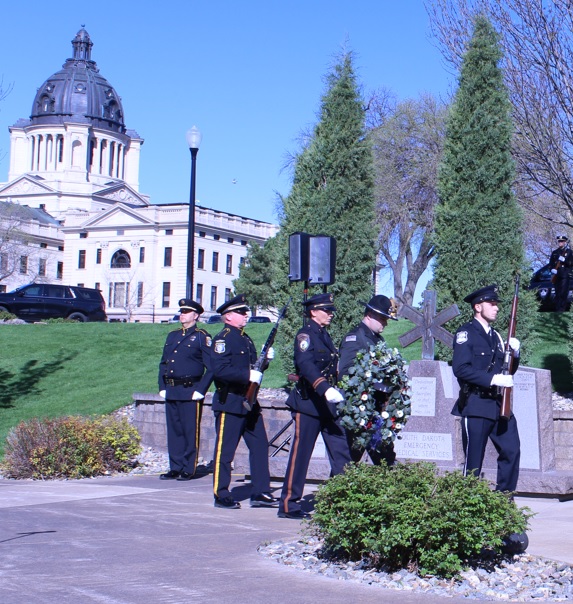 SDDOC Honor Guard member assists with wreath at Law Enforcement Memorial ceremony