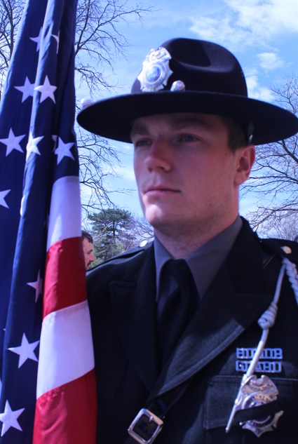 SDDOC Honor Guard member with flag at Law Enforcement Memorial