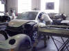 Inmates repair cars in the automotive shop